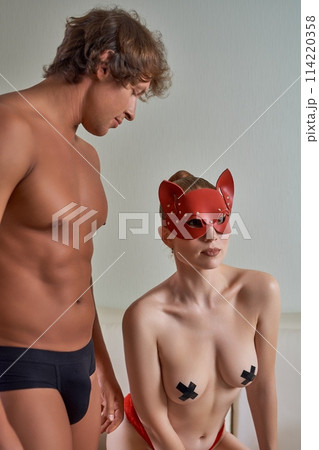 Sexy couple in role playing game at home Sexy couple in role playing game at home 114220358