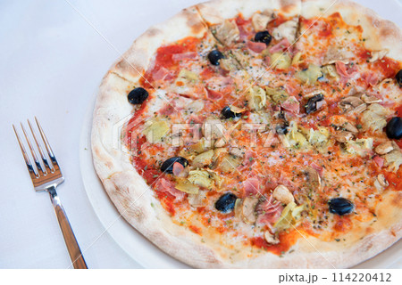 delicious pizza on white table 114220412