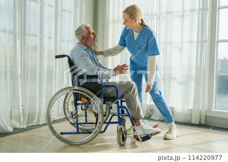 Help support retirement healthcare. Nurse helping old man in wheelchair. Patient and woman in nursing home for medical caregiver. Nurse taking care of paralyzed man in chair for people with disability 114220977