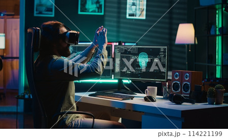 Ecstatic man celebrating after awakening AI using VR headset, making it ask existential questions. Happy developer excited to chat with artificial intelligence using virtual reality tech, camera A 114221199