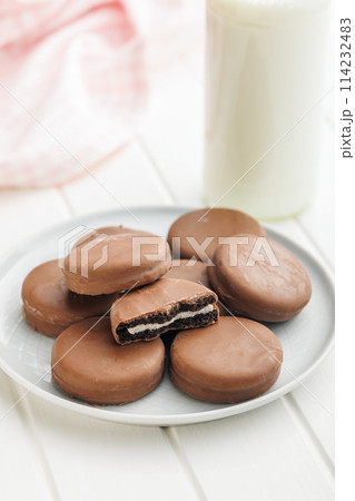 Plate of Chocolate Covered Cookies and Glass of Milk Plate of Chocolate Covered Cookies and Glass of Milk 114232483