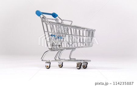 Small shopping cart isolated on solid background Small shopping cart isolated on solid background 114235887