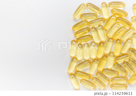 Pile of capsules Omega 3 on white background. Close-up, top view, copy space for your text.  114239611
