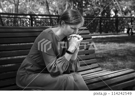 Pretty girl sitting on the bench Pretty girl sitting on the bench 114242549