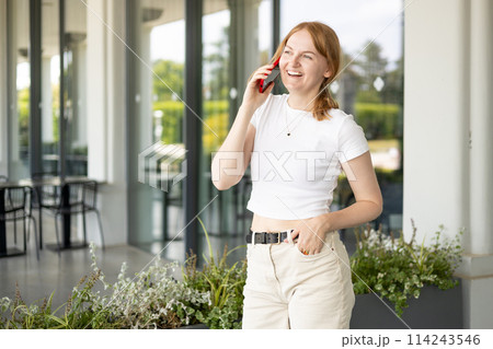 Happy blonde 30s woman talking phone and look happy outdoors Urban lifestyle concept. Summer time 114243546