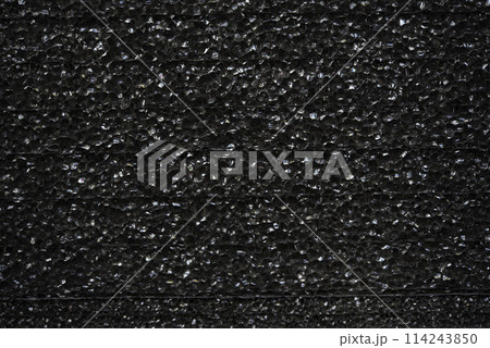Black porous porous foam background. Background texture of black foam rubber 114243850