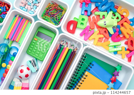 School supplies.Concept back to school. colored stationery is arranged in white organizers. Creative Drawer Organizing. Storage office supplies 114244657