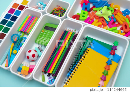 School supplies.Concept back to school. colored stationery is arranged in white organizers. Creative Drawer Organizing. Storage office supplies School supplies.Concept back to school. colored stationery is arranged in white organizers. Creative Drawer Organizing. Storage office supplies 114244665