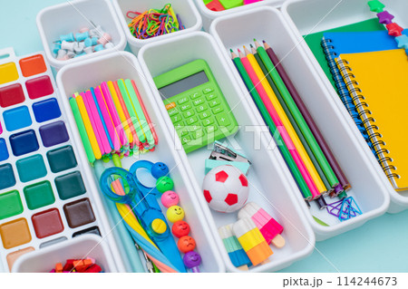 School supplies.Concept back to school. colored stationery is arranged in white organizers. Creative Drawer Organizing. Storage office supplies School supplies.Concept back to school. colored stationery is arranged in white organizers. Creative Drawer Organizing. Storage office supplies 114244673