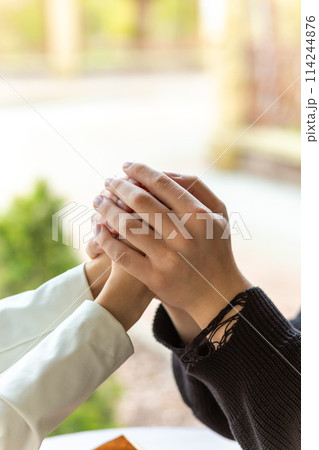 Couple enjoying a coffee holding hands. Couple enjoying a coffee holding hands. 114244876