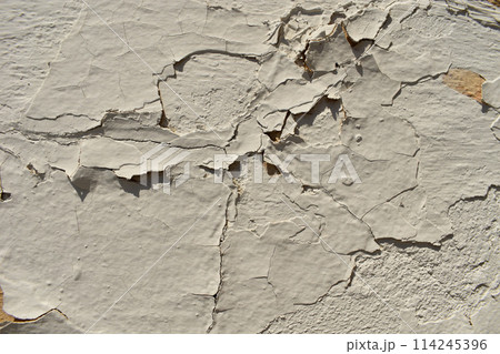 Dusty peeling paint wall background, texture of a concrete old wall with stains and cracks 114245396