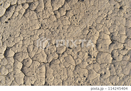 Dusty peeling paint wall background, texture of a concrete old wall with stains and cracks 114245404