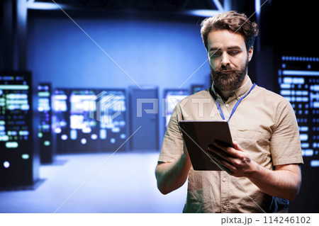 Manager in data center walking through server racks used for computationally intensive tasks such as quantum mechanics or weather forecasting. Specialist running annual equipment diagnosis Manager in data center walking through server racks used for computationally intensive tasks such as quantum mechanics or weather forecasting. Specialist running annual equipment diagnosis 114246102