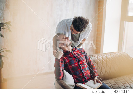 Cay couple enjoy togetherness indoors, kiss each other 114254334