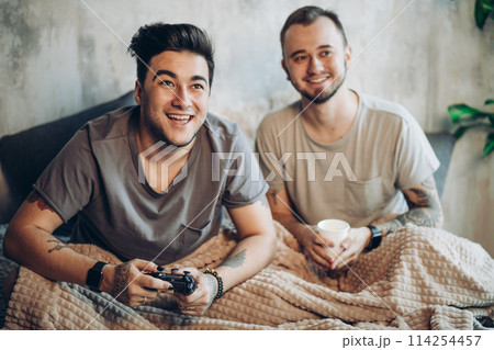 Gay Couple drinking milk Together In kitchen. Healthy Concept 114254457