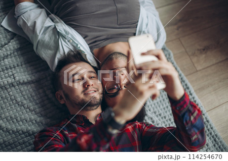gay couple making selfie in bed gay couple making selfie in bed 114254670