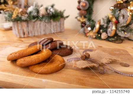 Home made giant cookies on wooden table with pieces of star anise and cinnamon 114255740