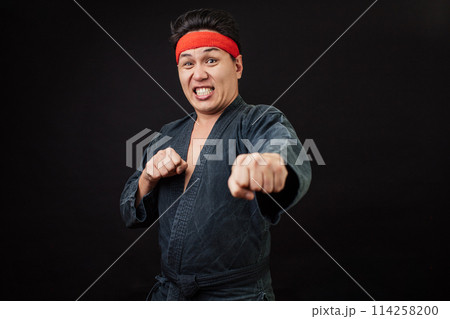 puzzled man has seen strong and muscular opponent 114258200