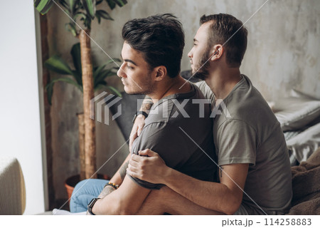 Two sexy caucasian gay guys hugging and having fun in bed indoors 114258883