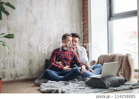 Homosexual partners working at office desk, relationships and business concept Homosexual partners working at office desk, relationships and business concept 114258885