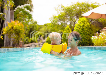 Mother and baby in swimming pool Mother and baby in swimming pool 114259643