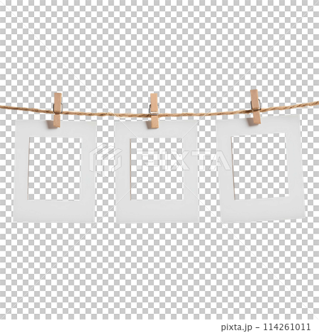 close up of a 3 blank note papers, photo frame on a rope with clothespins white background close up of a 3 blank note papers, photo frame on a rope with clothespins white background 114261011