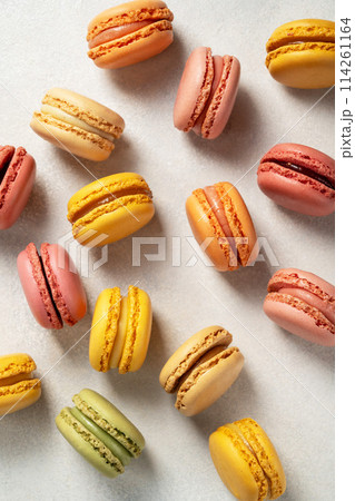 Colorful yellow, pink Macrons, top view, Sweet dessert, sugar Colorful yellow, pink Macrons, top view, Sweet dessert, sugar 114261164