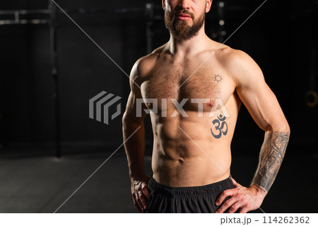 Portrait of handsome muscular man in gym. Routine workout for physical and mental health. 114262362