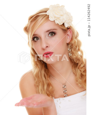 Wedding. Young woman romantic bride blowing a kiss 114262492