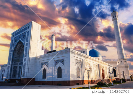 facade of modern white marble Islamic Masjid Minor Mosque in Tashkent in Uzbekistan on background of sunset sky in summer 114262705