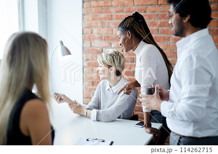 young ambitious employees are concentrated on video conference young ambitious employees are concentrated on video conference 114262715