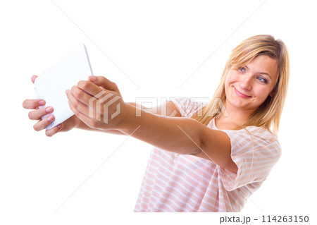 Woman taking self picture with tablet 114263150