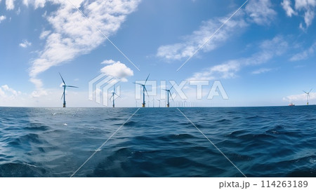 Offshore Windmill farm in the ocean, windmills isolated at sea on a sunny day. Generative AI 114263189