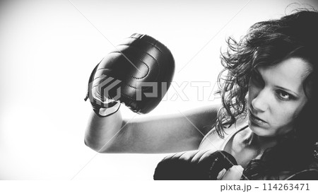 Boxer girl exercise with boxing gloves. Boxer girl exercise with boxing gloves. 114263471