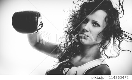 Boxer girl exercise with boxing gloves. Boxer girl exercise with boxing gloves. 114263472