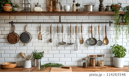 Kitchen brass utensils, chef accessories. Hanging kitchen with white tiles wall and wood tabletop.Green plant on kitchen background generated ai  114263546