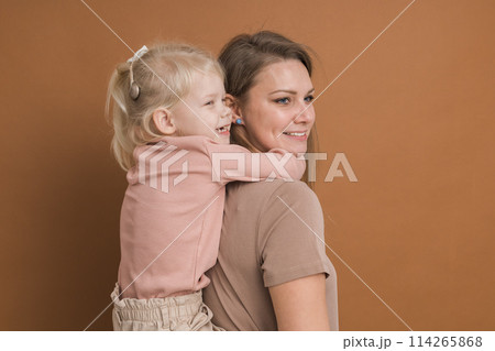 Deaf child girl with cochlear implant studying to hear sounds and have fun with mother - recovery after cochlear Implant surgery and rehabilitation concept Deaf child girl with cochlear implant studying to hear sounds and have fun with mother - recovery after cochlear Implant surgery and rehabilitation concept 114265868