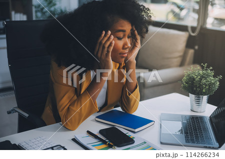 Business women are stressed while working on laptop, Tired asian businesswoman with headache at office, feeling sick at work, copy space Business women are stressed while working on laptop, Tired asian businesswoman with headache at office, feeling sick at work, copy space 114266234
