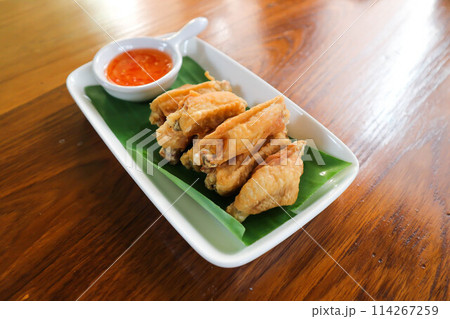 chicken wings or deep fried chicken , fried chicken and sauce chicken wings or deep fried chicken , fried chicken and sauce 114267259