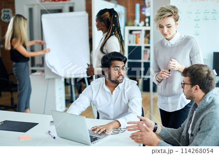 active energetic young business people making up ideas how th make money 114268054