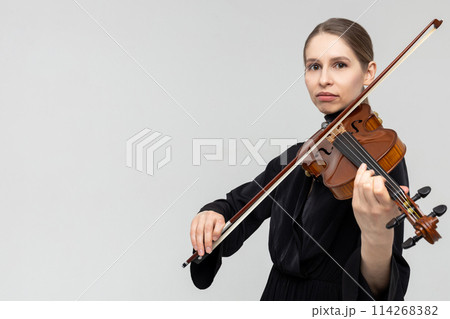 Woman professional violist playing musical instrument 114268382