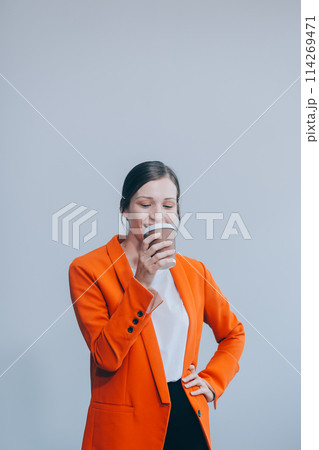 Business woman portrait with cup , isolated. Female model with long hair. Business woman portrait with cup , isolated. Female model with long hair. 114269471