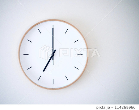 Isolated on white background Minimalist style wooden wall clock, showing time at 7.00 or 19.00 114269966