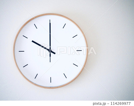 Isolated on white background Minimalist style wooden wall clock, showing time at 10.00 or 22.00 114269977