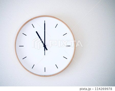 Isolated on white background Minimalist style wooden wall clock, showing time at 11.00 or 23.00 114269978