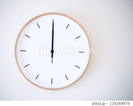 Isolated on white background Minimalist style wooden wall clock, showing time at 12.00 or 0.00 Isolated on white background Minimalist style wooden wall clock, showing time at 12.00 or 0.00 114269979
