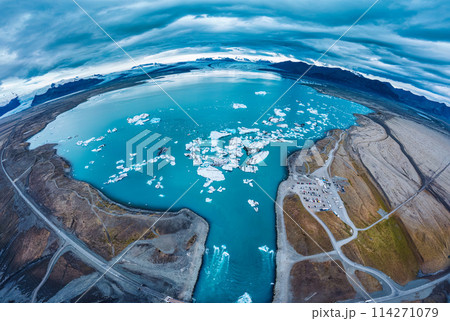 Jokulsarlon glacier lagoon with iceberg floating on gloomy day in Vatnajokull national park, Iceland 114271079