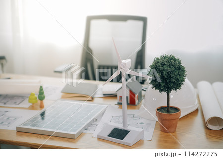 Wind energy engineer designing and developing project for residential district 114272275