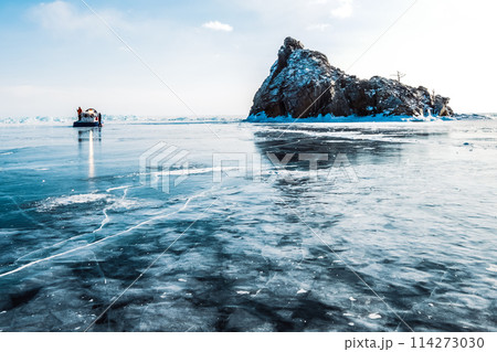 View of the rock in the frozen lake. Hivus is standing nearby 114273030