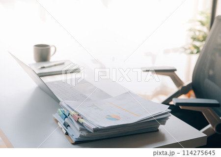 Office workplace with laptop and smart phone on wood table Office workplace with laptop and smart phone on wood table 114275645